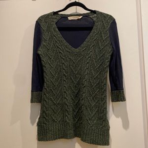 Green sweater with blue knit sleeves and back